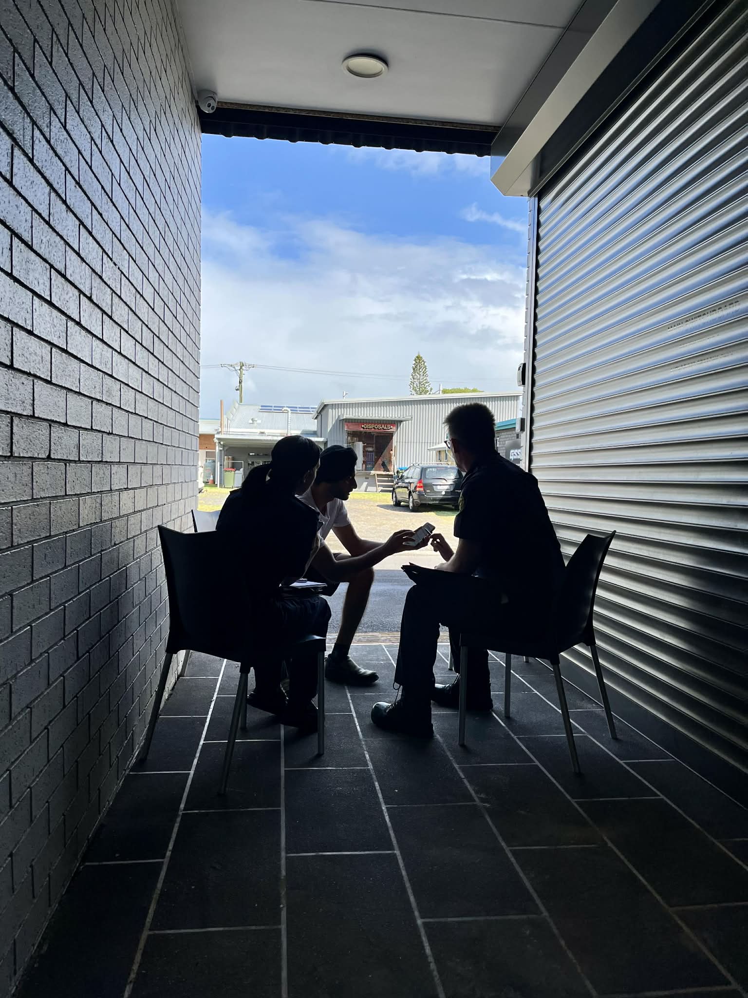 ABF officers speaking with an individual during Operation ODIN targeting regional hospitality businesses across the country.